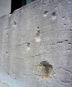 Damage on the facade of the JP Morgan bank building (photo taken January 2006)
